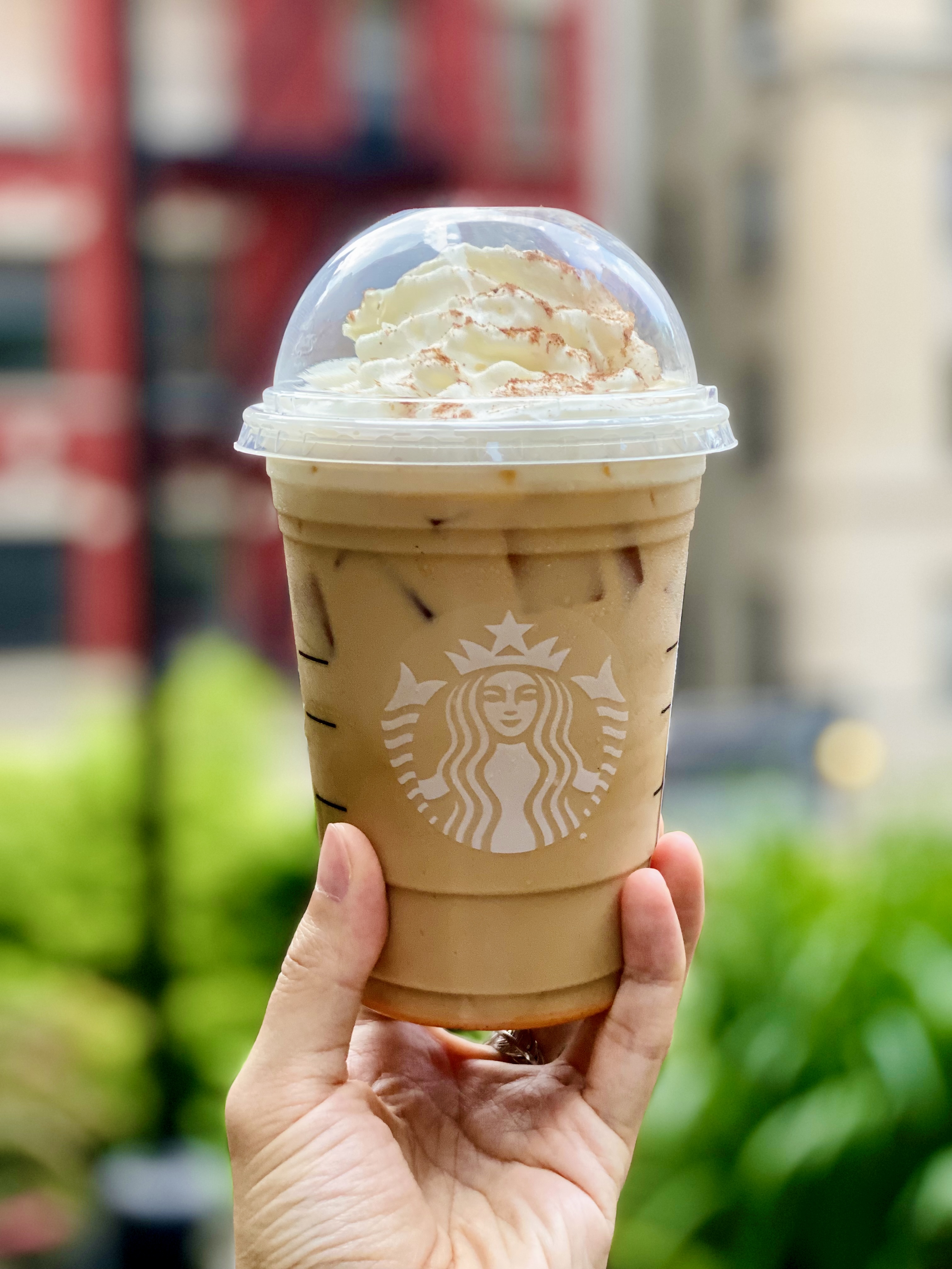 Starbucks PSL in hand